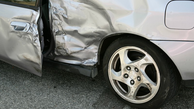 Crushed Grey Car Before Professional Auto Body Repair